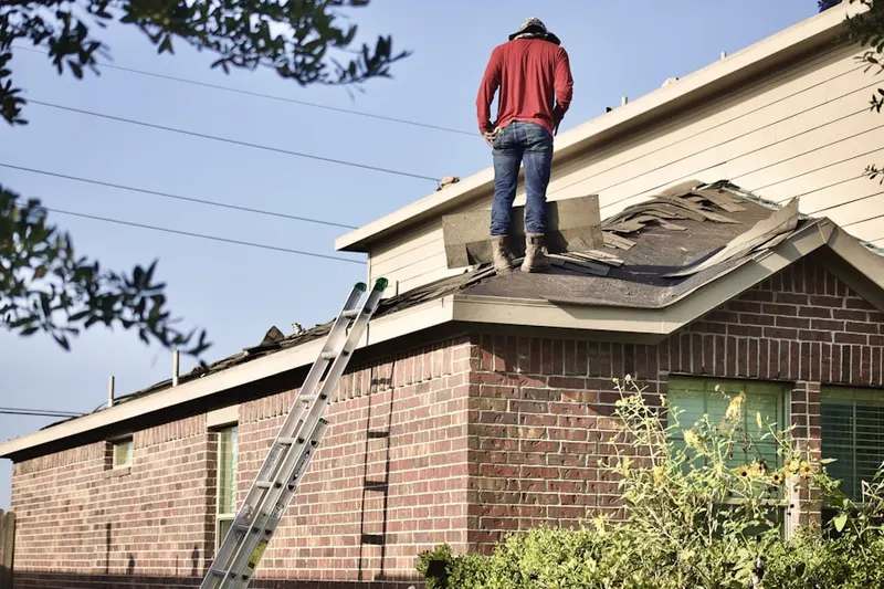 Professional roofer working on a residential roof in Fountain Valley Ranch
